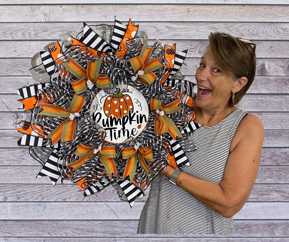 Stephanie Williams with pumpkin time fall wreath